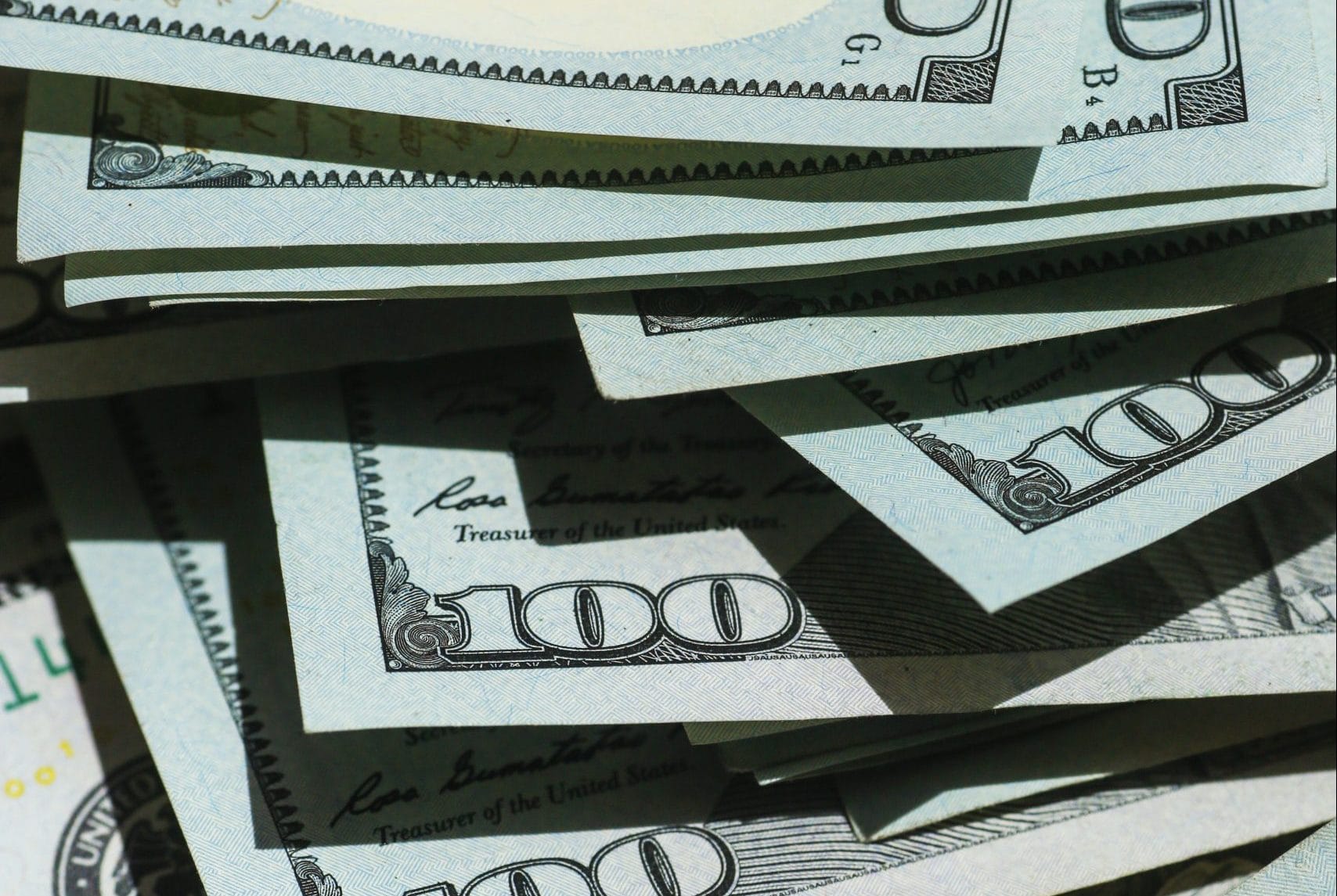 giorgio-trovato-WyxqQpyFNk8-unsplash (1) 100 dollar bills