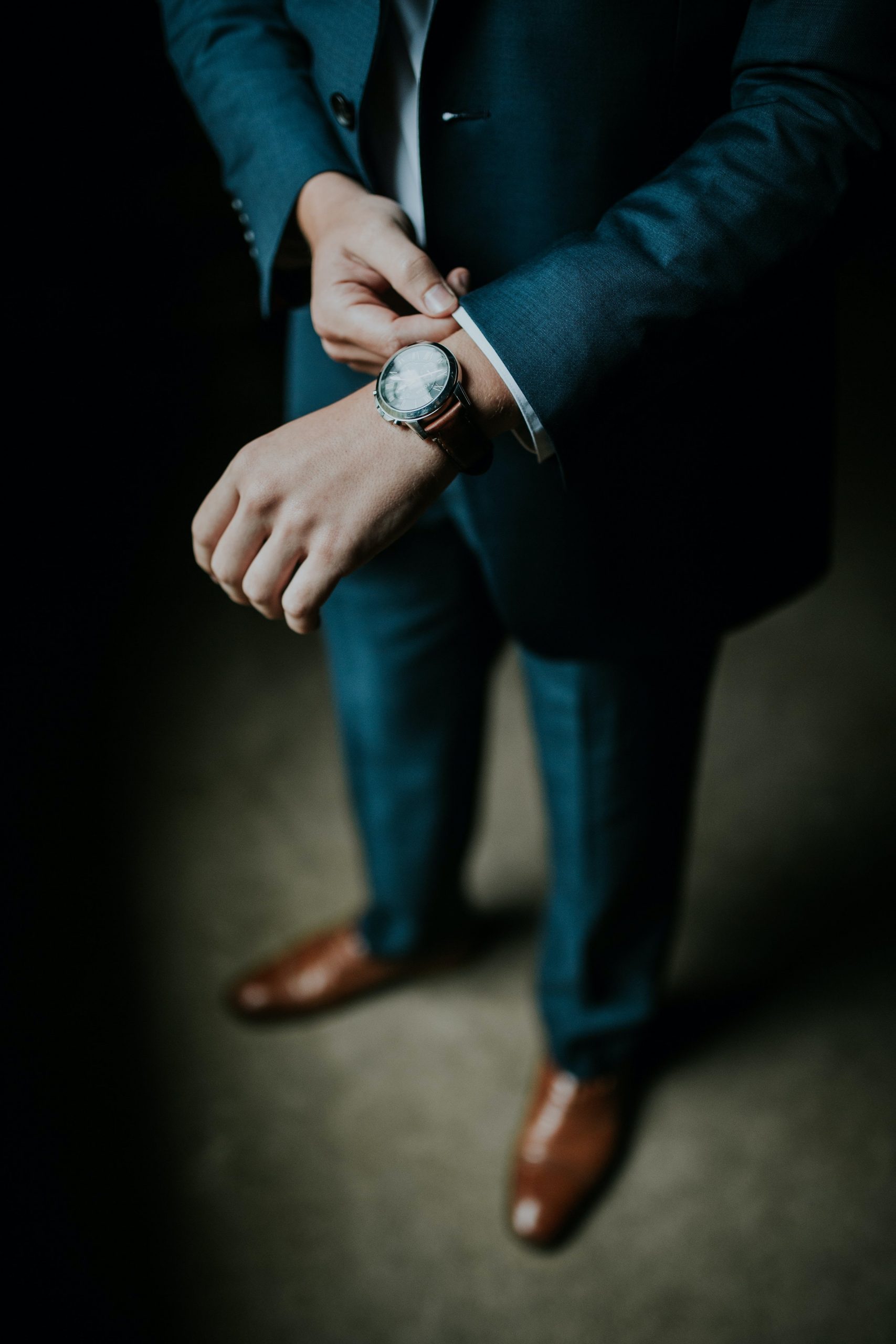 Man in suit with a watch
