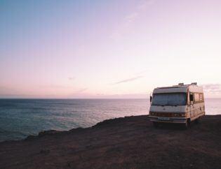 RV on a cliff overlooking the ocean